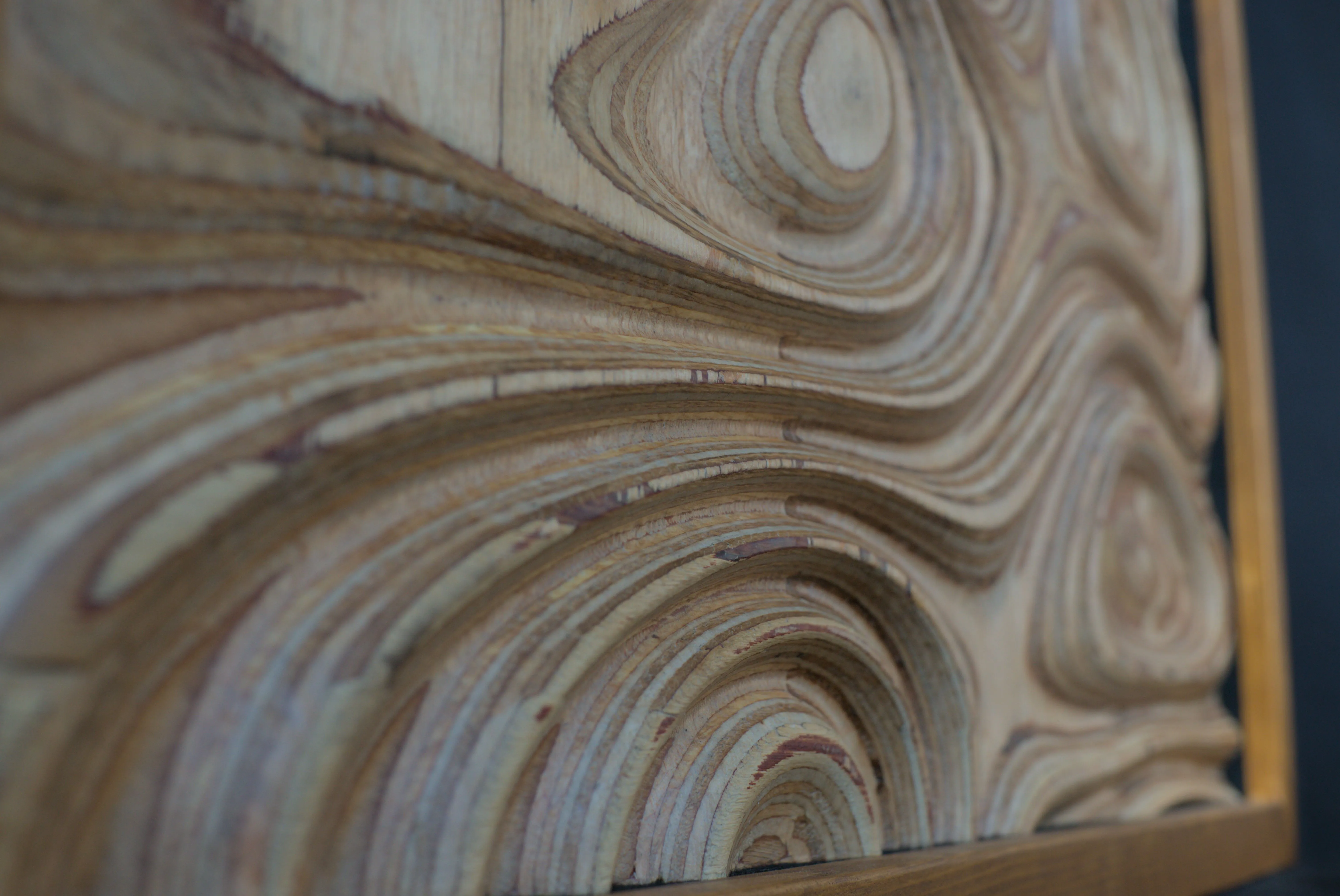 Close up view of a contoured plywood surface.
