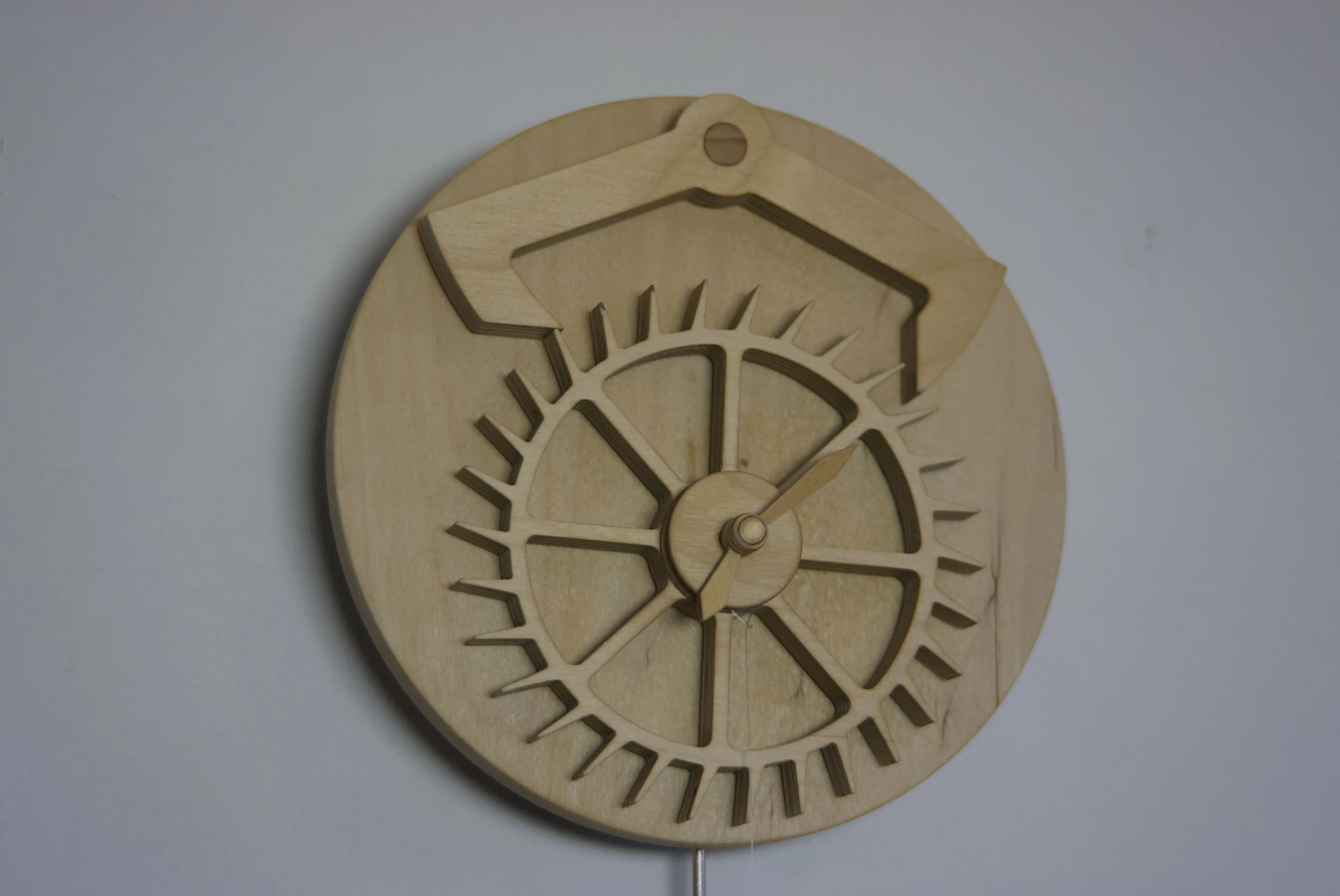 Closeup view of a clock with a decorative  escapement mechanism.