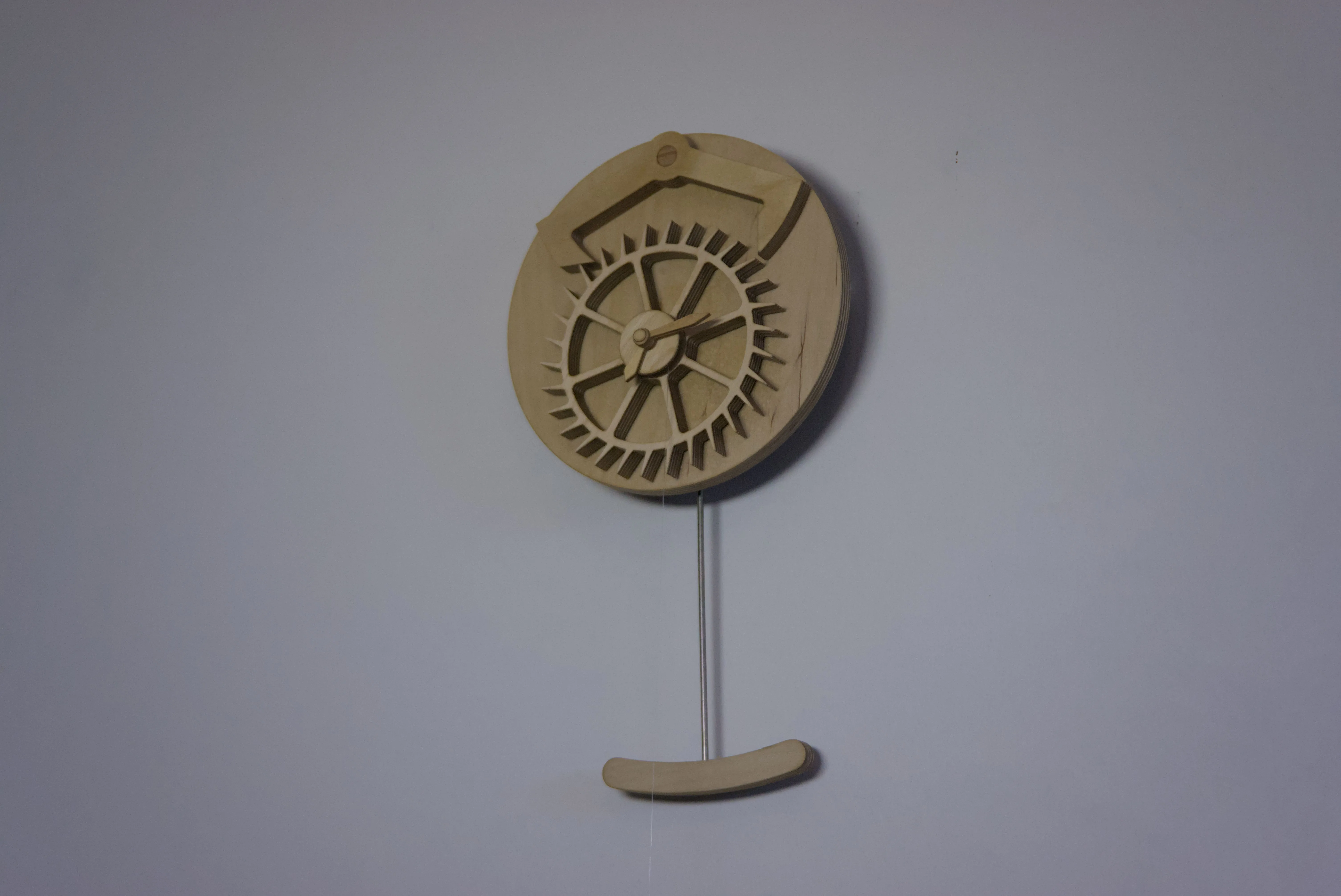 View of a clock with a decorative escapement.